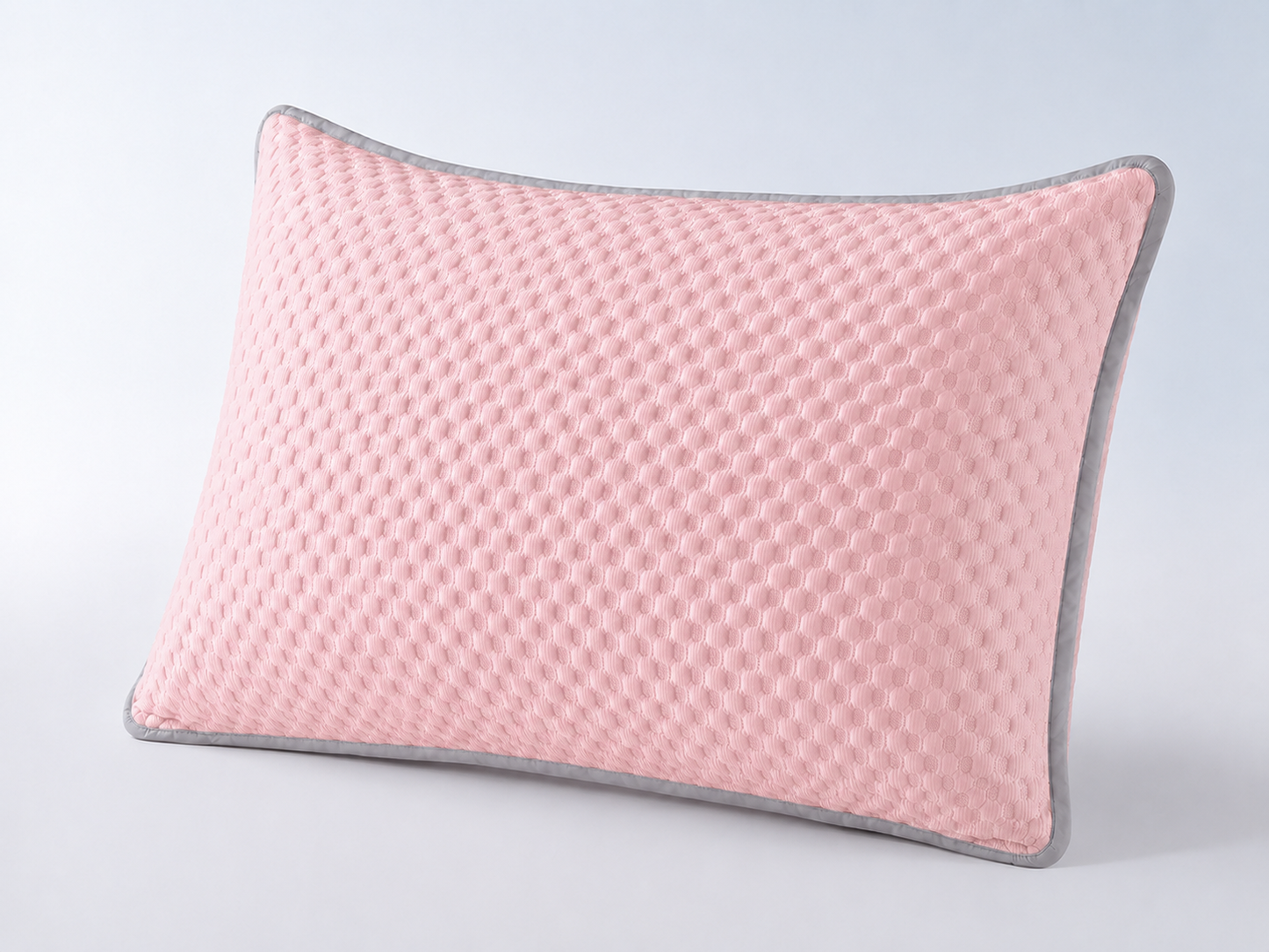 Breathable cooling pillowcase made from ice silk fabric in light pink