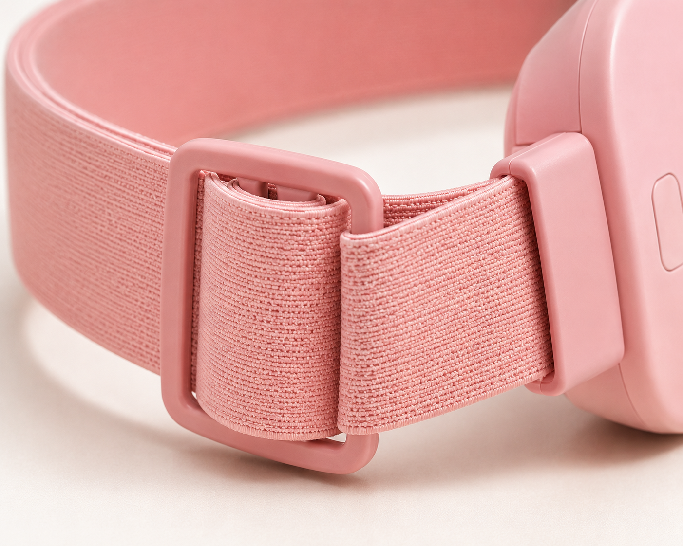 Close-up of the Premium heat and massage belt adjustable pink elastic strap and secure buckle